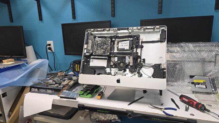 Opened all-in-one desktop computer on the repair bench