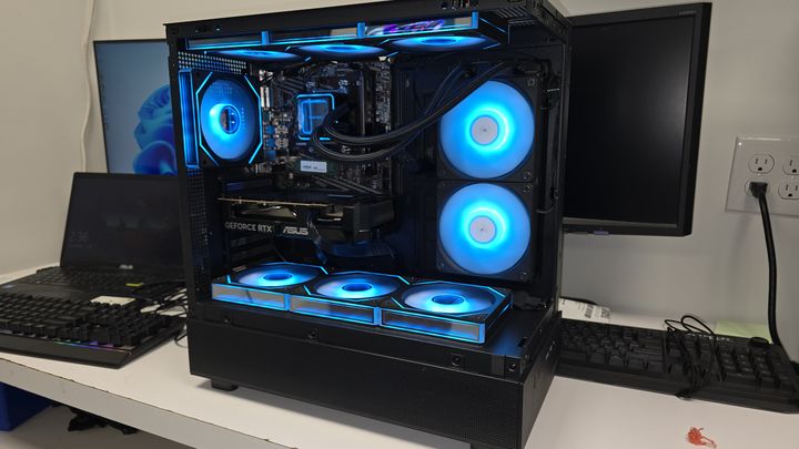 Black gaming PC with blue illuminated cooling fans