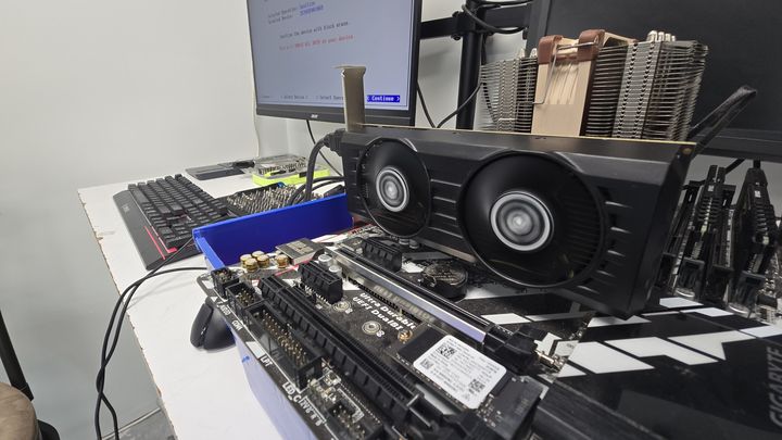 Motherboard and graphics card on an open computer test bench