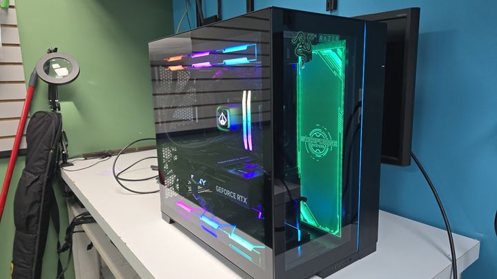 Glass sided gaming PC with green and multicolor lighting