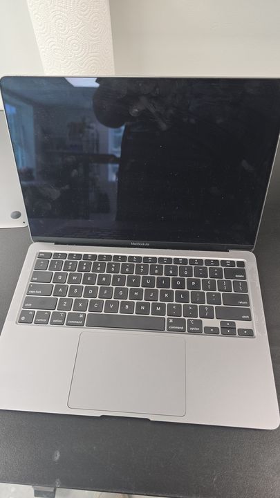 Silver MacBook Air on the repair workbench