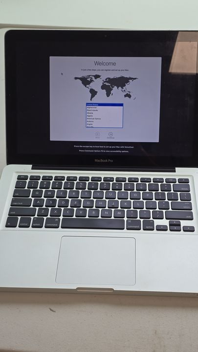 MacBook Pro displaying its welcome setup screen